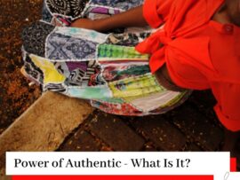 Woman in a skirt and red blouse sat down and looking up with the title Power of Authentic