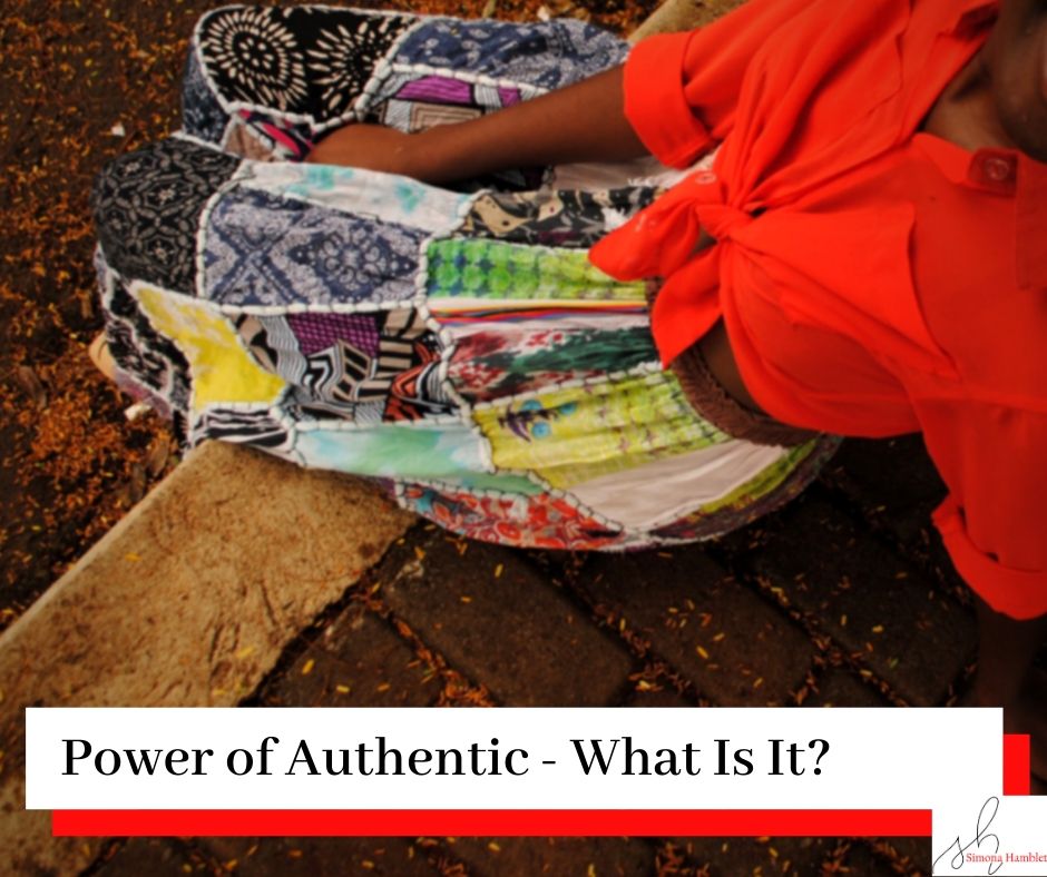 Woman in a skirt and red blouse sat down and looking up with the title Power of Authentic